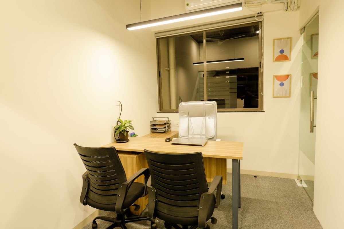 Manager cabin with meeting chairs, managed office built by Workin Space