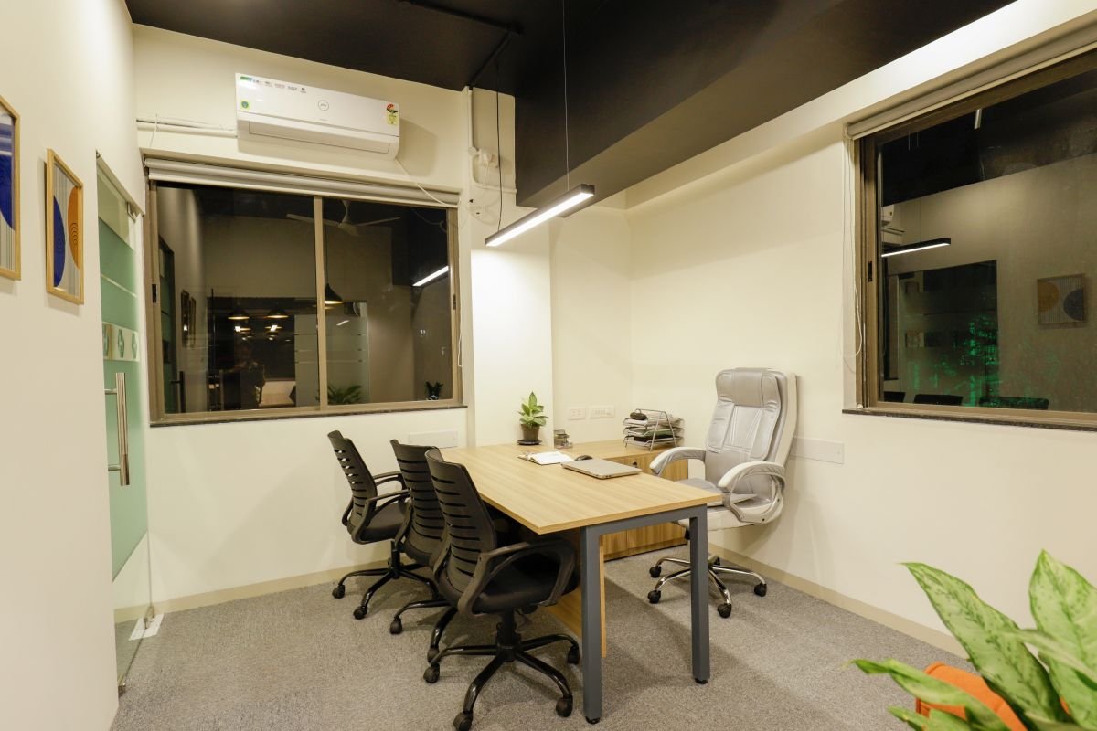 Cabin with desk, chairs and window, managed office built by Workin Space