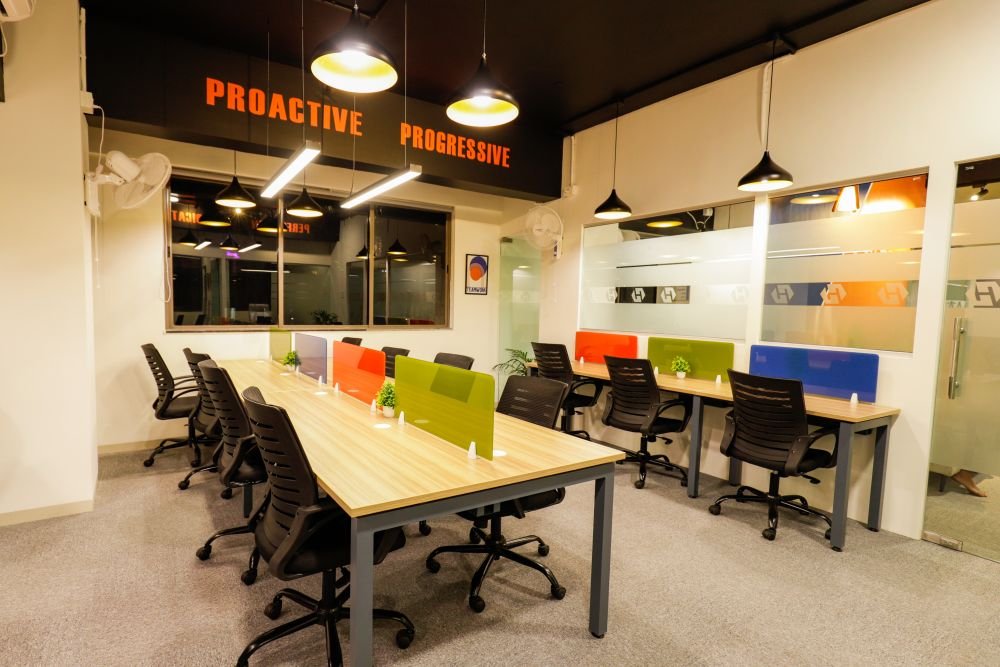 Dedicated desks in a managed office by Workin Space, Pune
